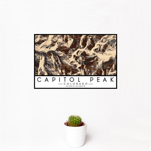 12x18 Capitol Peak Colorado Map Print Landscape Orientation in Ember Style With Small Cactus Plant in White Planter