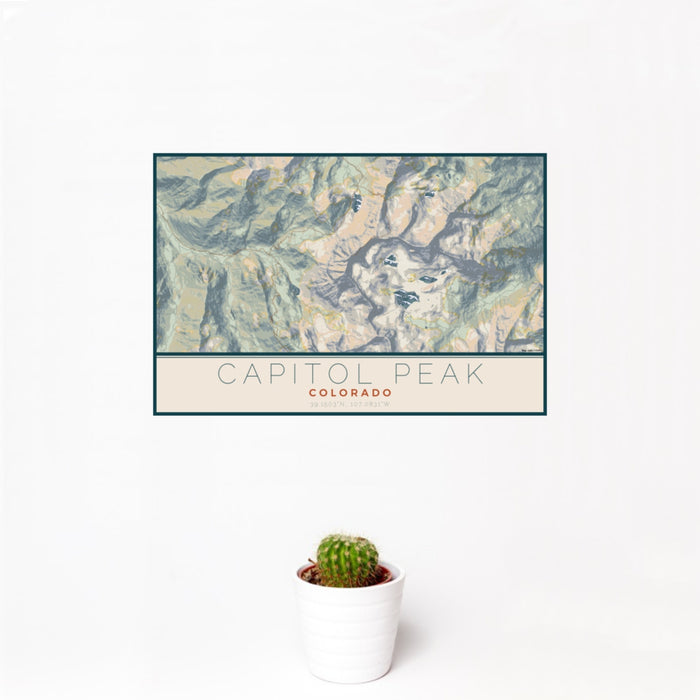 12x18 Capitol Peak Colorado Map Print Landscape Orientation in Woodblock Style With Small Cactus Plant in White Planter