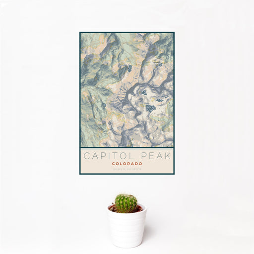 12x18 Capitol Peak Colorado Map Print Portrait Orientation in Woodblock Style With Small Cactus Plant in White Planter