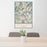 24x36 Capitol Peak Colorado Map Print Portrait Orientation in Woodblock Style Behind 2 Chairs Table and Potted Plant