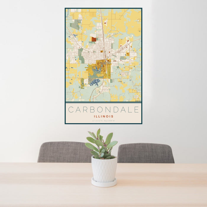 24x36 Carbondale Illinois Map Print Portrait Orientation in Woodblock Style Behind 2 Chairs Table and Potted Plant