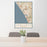 24x36 Carlsbad California Map Print Portrait Orientation in Woodblock Style Behind 2 Chairs Table and Potted Plant