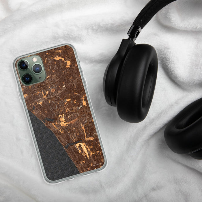 Custom Carlsbad California Map Phone Case in Ember on Table with Black Headphones