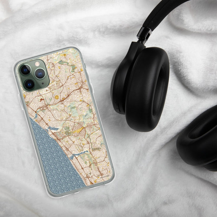 Custom Carlsbad California Map Phone Case in Woodblock on Table with Black Headphones