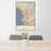 24x36 Carmel-by-the-Sea California Map Print Portrait Orientation in Woodblock Style Behind 2 Chairs Table and Potted Plant