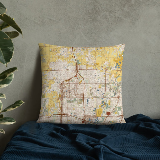 Custom Carmel Indiana Map Throw Pillow in Woodblock on Bedding Against Wall