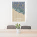 24x36 Carpinteria California Map Print Portrait Orientation in Afternoon Style Behind 2 Chairs Table and Potted Plant