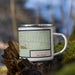 Right View Custom Carrizozo New Mexico Map Enamel Mug in Woodblock on Grass With Trees in Background