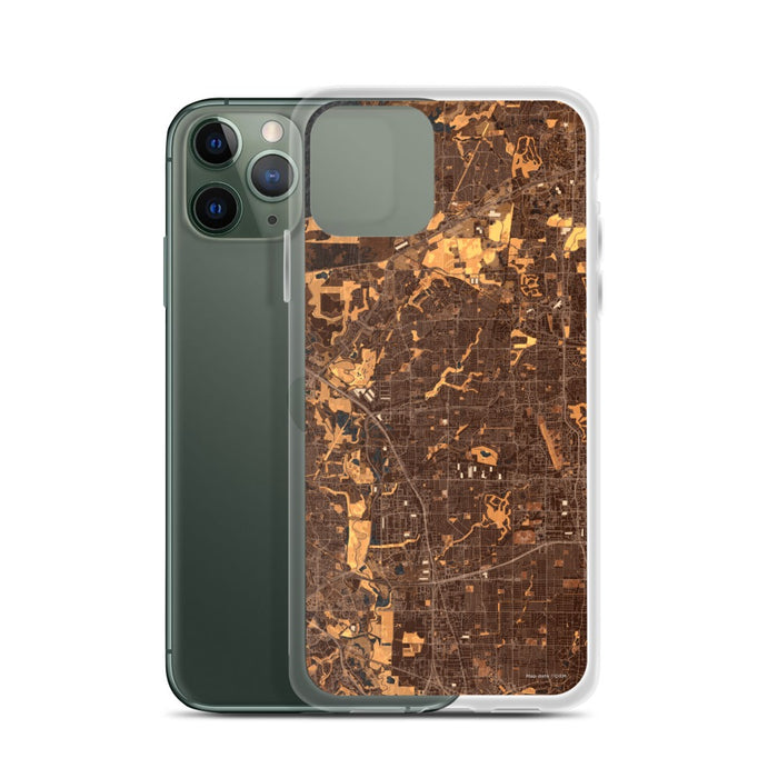 Custom Carrollton Texas Map Phone Case in Ember on Table with Laptop and Plant