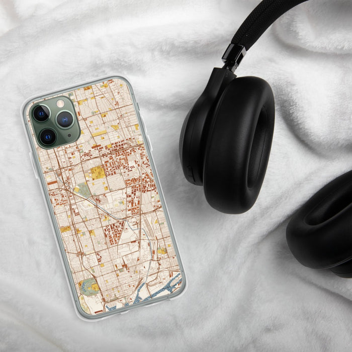 Custom Carson California Map Phone Case in Woodblock on Table with Black Headphones