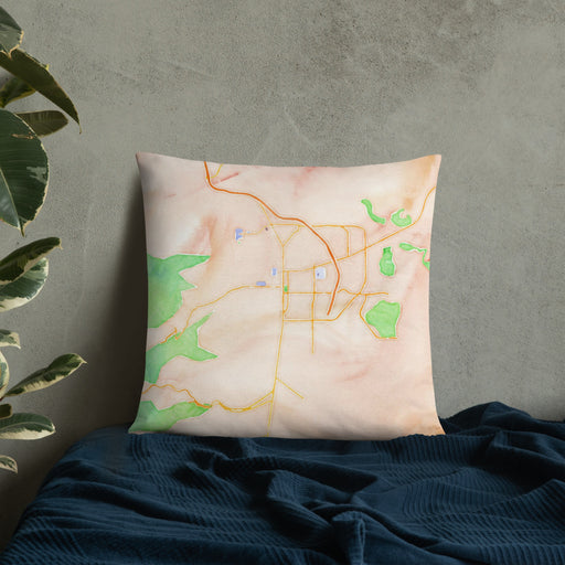 Custom Carson City Nevada Map Throw Pillow in Watercolor on Bedding Against Wall