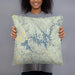 Person holding 18x18 Custom Carters Lake Georgia Map Throw Pillow in Woodblock
