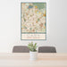 24x36 Cary North Carolina Map Print Portrait Orientation in Woodblock Style Behind 2 Chairs Table and Potted Plant