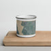 Front View Custom Cascade Idaho Map Enamel Mug in Afternoon on Cutting Board