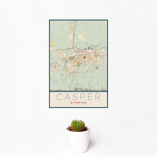 12x18 Casper Wyoming Map Print Portrait Orientation in Woodblock Style With Small Cactus Plant in White Planter