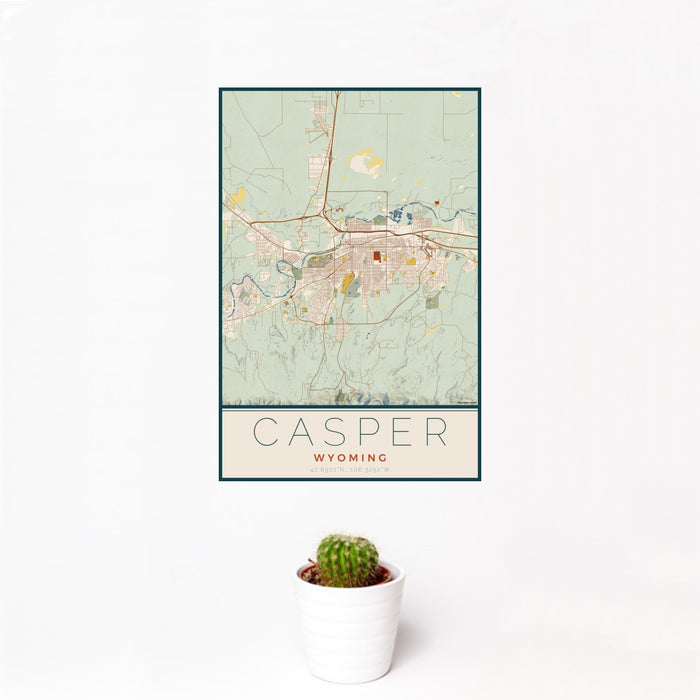 12x18 Casper Wyoming Map Print Portrait Orientation in Woodblock Style With Small Cactus Plant in White Planter