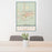 24x36 Casper Wyoming Map Print Portrait Orientation in Woodblock Style Behind 2 Chairs Table and Potted Plant