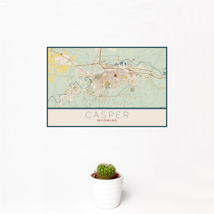 12x18 Casper Wyoming Map Print Landscape Orientation in Woodblock Style With Small Cactus Plant in White Planter