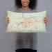 Person holding 20x12 Custom Casper Wyoming Map Throw Pillow in Woodblock