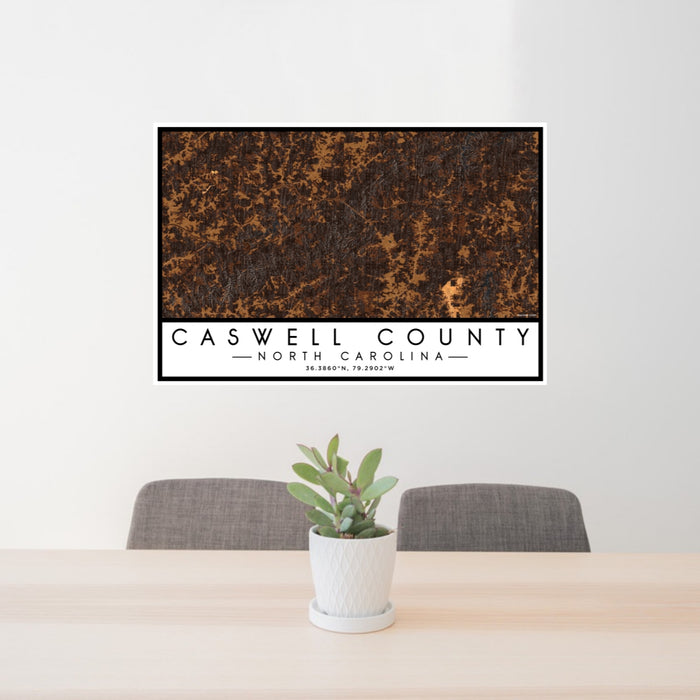 24x36 Caswell County North Carolina Map Print Lanscape Orientation in Ember Style Behind 2 Chairs Table and Potted Plant