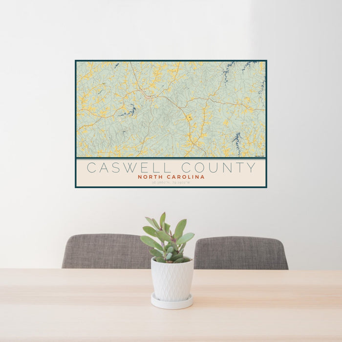 24x36 Caswell County North Carolina Map Print Lanscape Orientation in Woodblock Style Behind 2 Chairs Table and Potted Plant