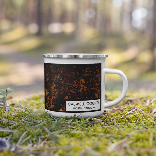 Right View Custom Caswell County North Carolina Map Enamel Mug in Ember on Grass With Trees in Background