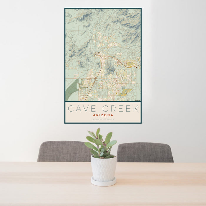 24x36 Cave Creek Arizona Map Print Portrait Orientation in Woodblock Style Behind 2 Chairs Table and Potted Plant