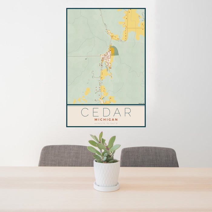 24x36 Cedar Michigan Map Print Portrait Orientation in Woodblock Style Behind 2 Chairs Table and Potted Plant