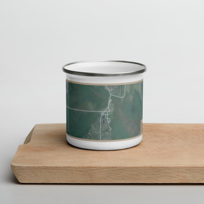 Front View Custom Cedar Michigan Map Enamel Mug in Afternoon on Cutting Board