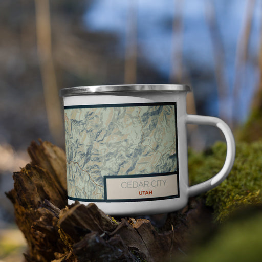 Right View Custom Cedar City Utah Map Enamel Mug in Woodblock on Grass With Trees in Background