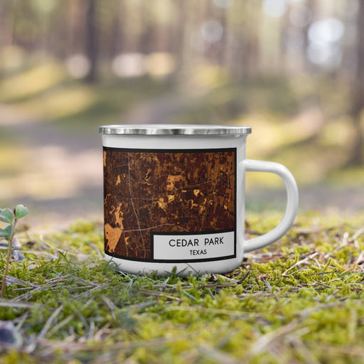 Right View Custom Cedar Park Texas Map Enamel Mug in Ember on Grass With Trees in Background