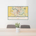 24x36 Cedar Rapids Iowa Map Print Landscape Orientation in Woodblock Style Behind 2 Chairs Table and Potted Plant