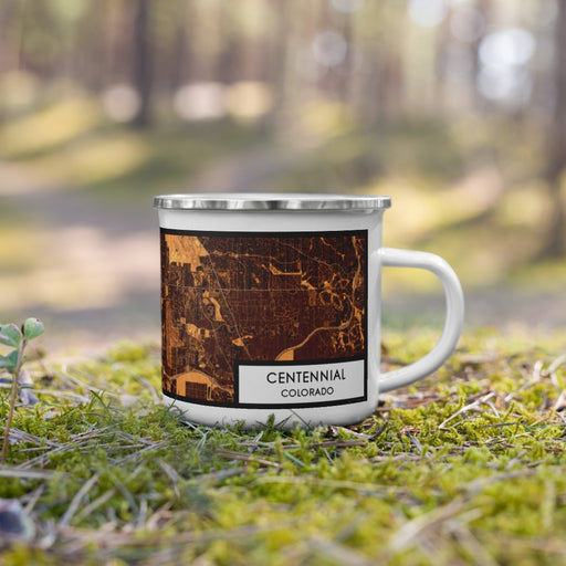 Right View Custom Centennial Colorado Map Enamel Mug in Ember on Grass With Trees in Background