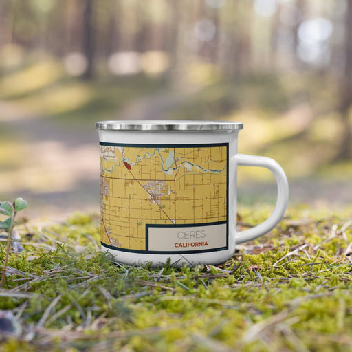 Right View Custom Ceres California Map Enamel Mug in Woodblock on Grass With Trees in Background
