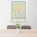 24x36 Chadron Nebraska Map Print Portrait Orientation in Woodblock Style Behind 2 Chairs Table and Potted Plant