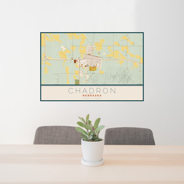 24x36 Chadron Nebraska Map Print Landscape Orientation in Woodblock Style Behind 2 Chairs Table and Potted Plant