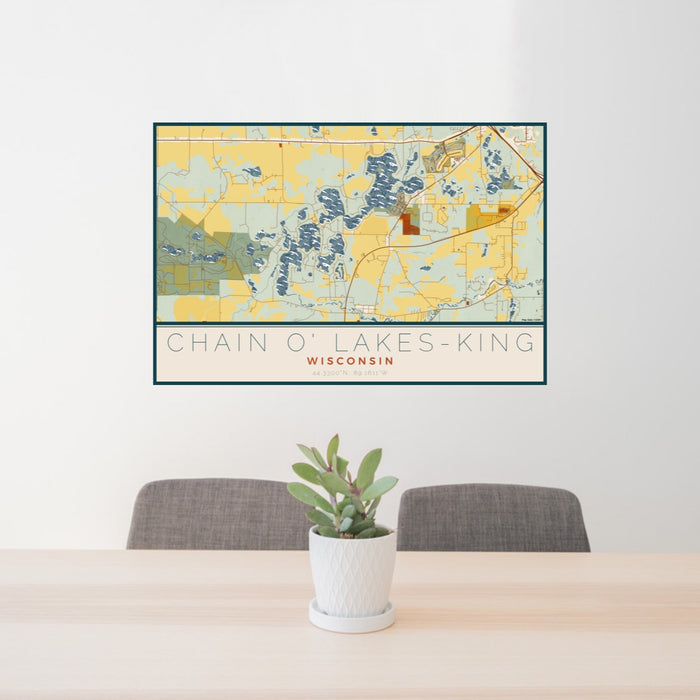 24x36 Chain O' Lakes-King Wisconsin Map Print Lanscape Orientation in Woodblock Style Behind 2 Chairs Table and Potted Plant