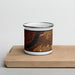 Front View Custom Chamberlain South Dakota Map Enamel Mug in Ember on Cutting Board