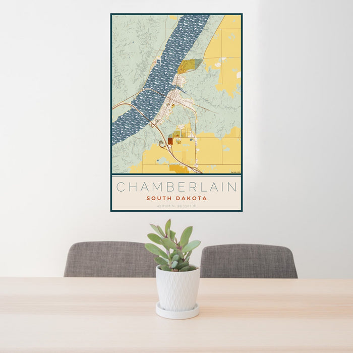 24x36 Chamberlain South Dakota Map Print Portrait Orientation in Woodblock Style Behind 2 Chairs Table and Potted Plant