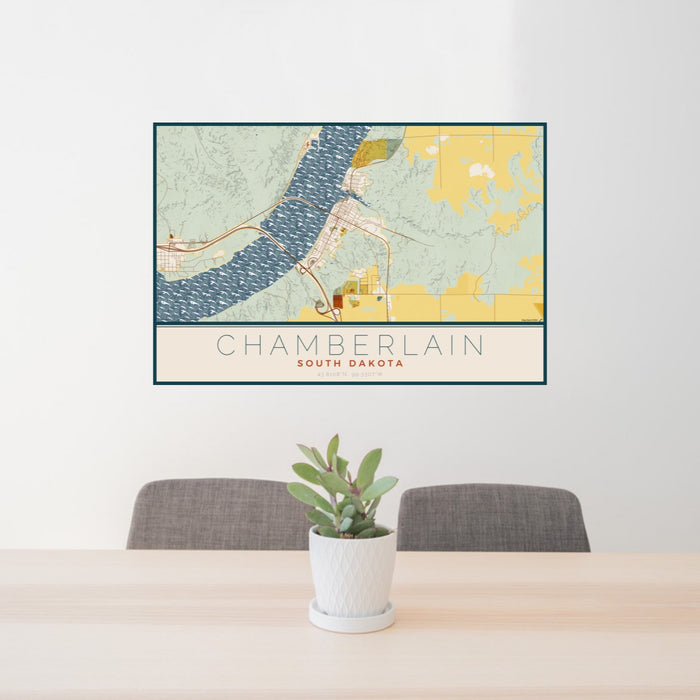 24x36 Chamberlain South Dakota Map Print Landscape Orientation in Woodblock Style Behind 2 Chairs Table and Potted Plant