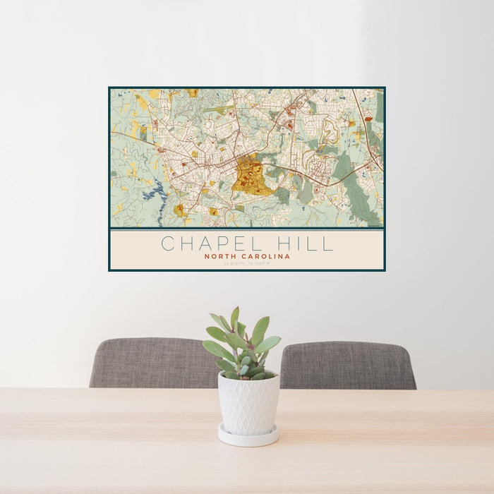 24x36 Chapel Hill North Carolina Map Print Landscape Orientation in Woodblock Style Behind 2 Chairs Table and Potted Plant