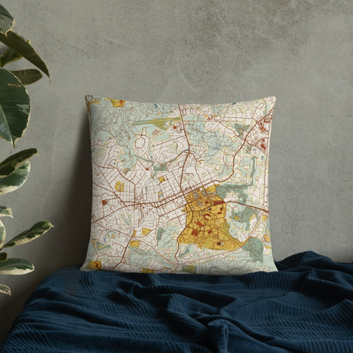 Custom Chapel Hill North Carolina Map Throw Pillow in Woodblock on Bedding Against Wall
