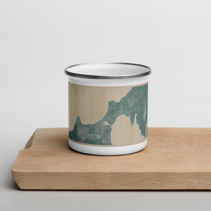 Front View Custom Charlevoix Michigan Map Enamel Mug in Afternoon on Cutting Board