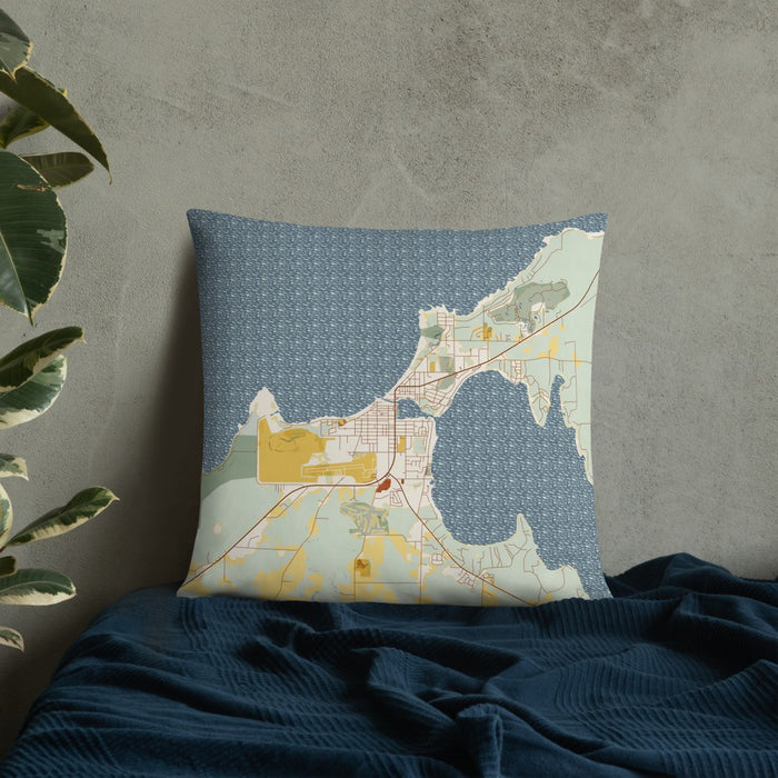 Custom Charlevoix Michigan Map Throw Pillow in Woodblock on Bedding Against Wall