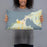 Person holding 20x12 Custom Charlevoix Michigan Map Throw Pillow in Woodblock