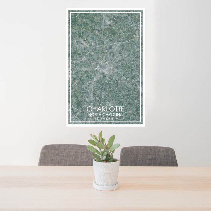 24x36 Charlotte North Carolina Map Print Portrait Orientation in Afternoon Style Behind 2 Chairs Table and Potted Plant