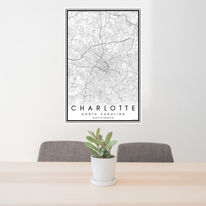 24x36 Charlotte North Carolina Map Print Portrait Orientation in Classic Style Behind 2 Chairs Table and Potted Plant