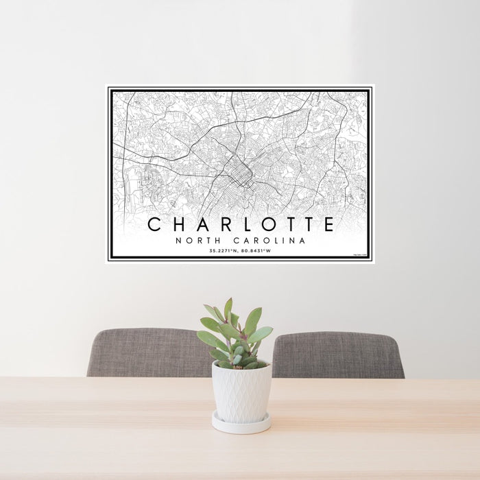 24x36 Charlotte North Carolina Map Print Landscape Orientation in Classic Style Behind 2 Chairs Table and Potted Plant