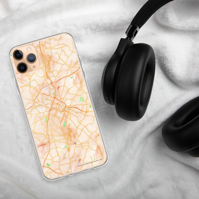Custom Charlotte North Carolina Map Phone Case in Watercolor on Table with Black Headphones