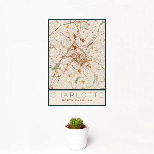 12x18 Charlotte North Carolina Map Print Portrait Orientation in Woodblock Style With Small Cactus Plant in White Planter